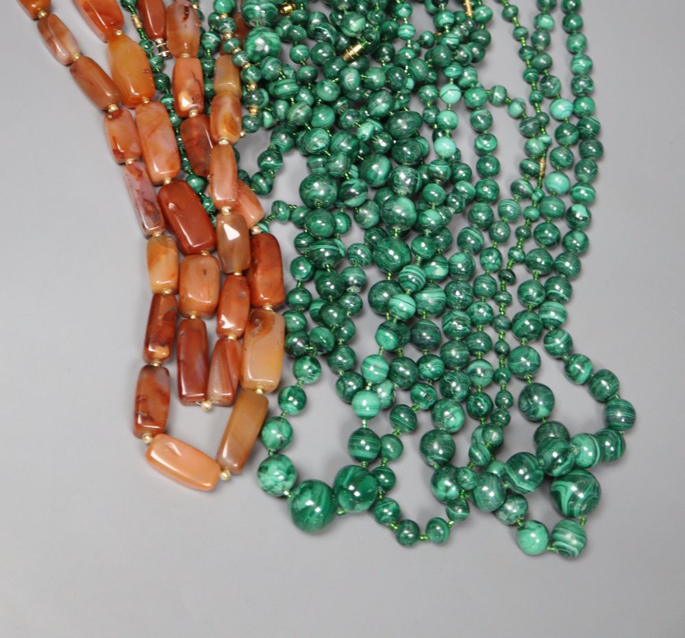 Nine assorted single strand malachite bead necklaces, one with gilt metal spacers and two agate pebble necklaces, largest 64cm.